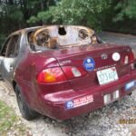 RedToyota-in-salvage-yard-3.jpg